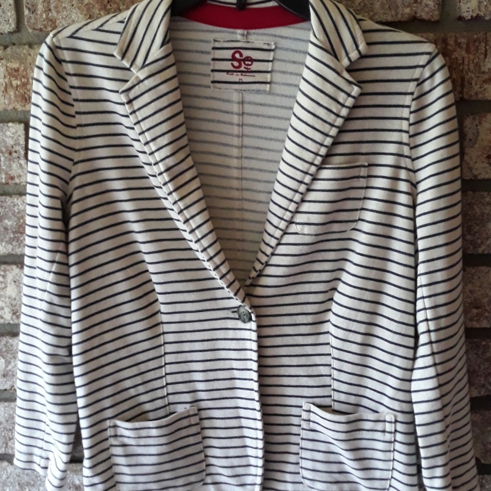 A soft beige and black accent  jacket